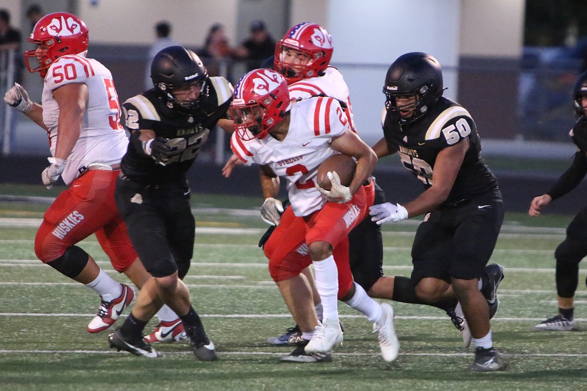 The Royal defensive line gets into the backfield against Othello on Sept. 8.