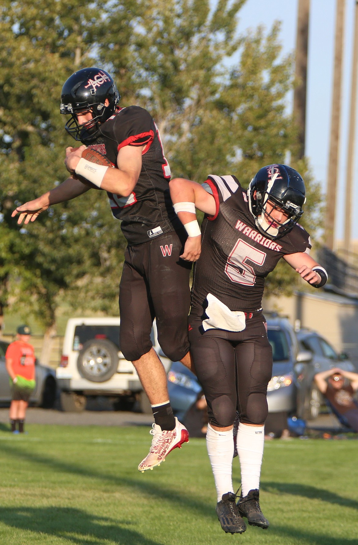 ACH freshman Max Grindy, left, and junior Grayson Beal, right, celebrate after a touchdown against Liberty Bell.