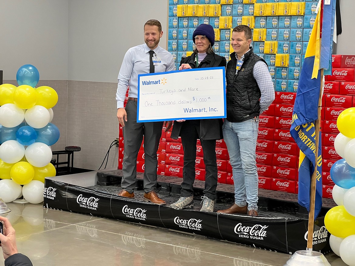 Turkeys & More President Nancy Nelson thanks Walmart at Stateline for a Platinum donation of $1,000. This and other donations are helping the nonprofit group pay for 2,000 Thanksgiving turkeys. The Mullan Avenue Walmart in Post Falls was a Gold donor of $500. These birds will be distributed on Friday, Nov. 17 to more than 20 local food banks and agencies serving vulnerable populations. It's not too late to make a donation by sending a check to P.O. Box 267, Coeur d'Alene, ID 83816; or giving safely online at turkeysandmore.org. Founder Evalyn Adams said only about $4,000 still needs to be raised to pay for the turkeys. All Super 1 stores in Kootenai County are now accepting donations at the check stand. For more information on how you can help Fight Hunger and Feed Hope, call Adams at 208-765-5535. Pictured from left: Walmart Market Manager Clinton Solvarp; Turkeys & More President Nancy Nelson and Store Manager Karl Bonner.