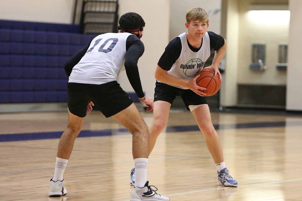 Big Bend freshman Cole Palmer, right, keeps his eyes toward the rim during a drill.