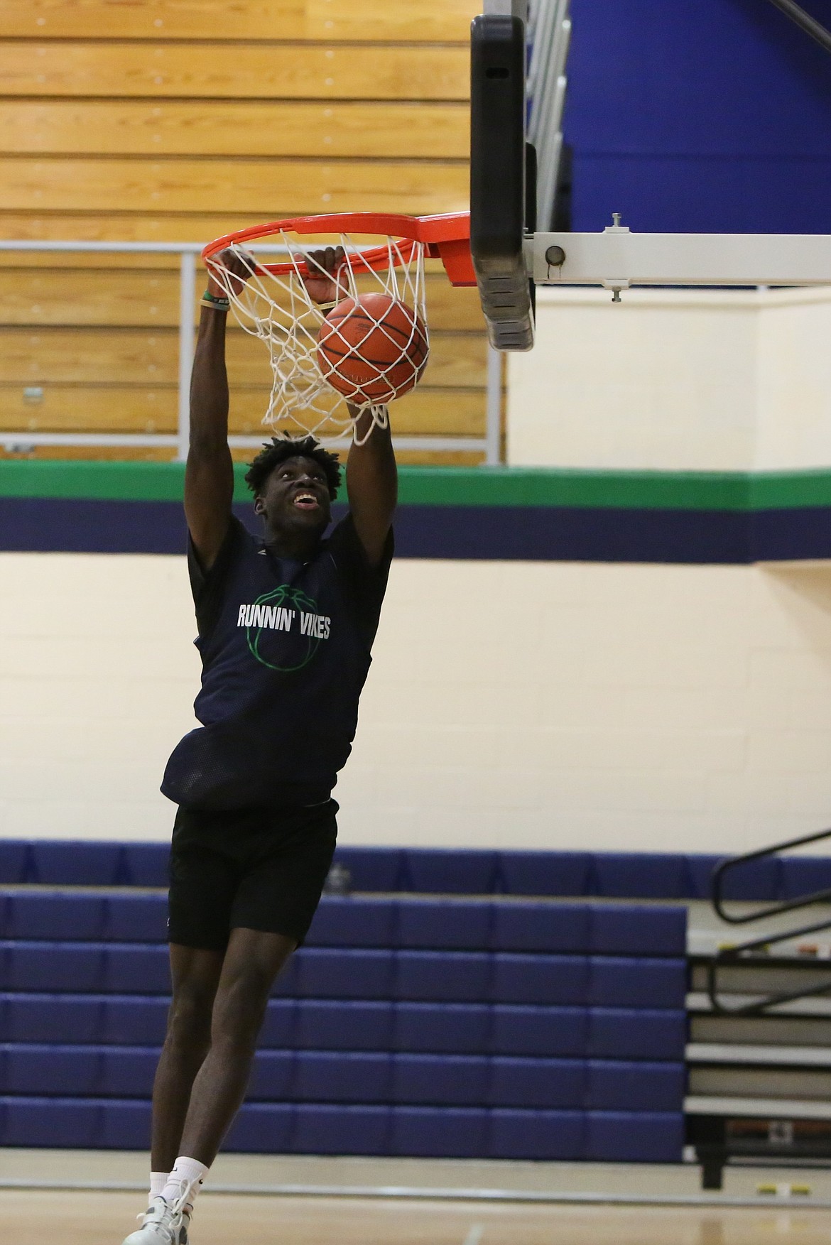 Big Bend sophomore Mailk Beauford dunks the ball during practice.