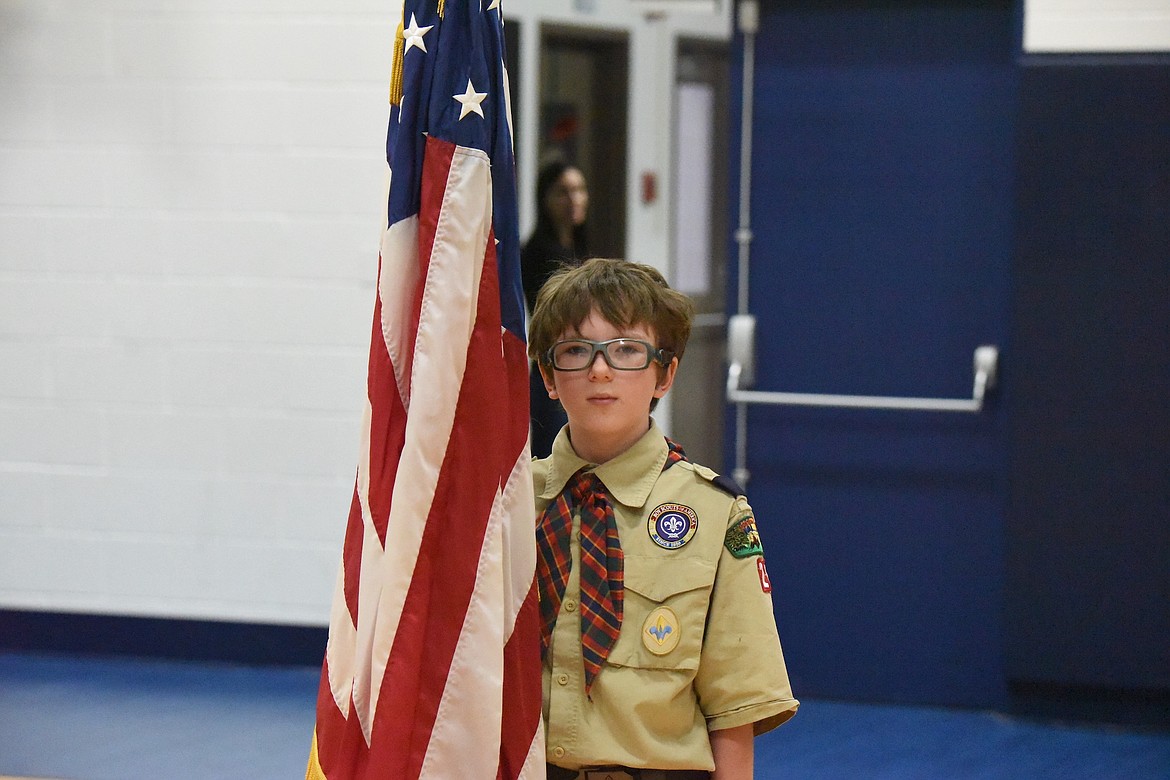 Ten-year-old Cub Scout Emmette presented the U.S. flag during a Veterans Day ceremony Friday, Nov. 10, at W.F. Morrison Elementary School in Troy. (Scott Shindledecker/The Western News)