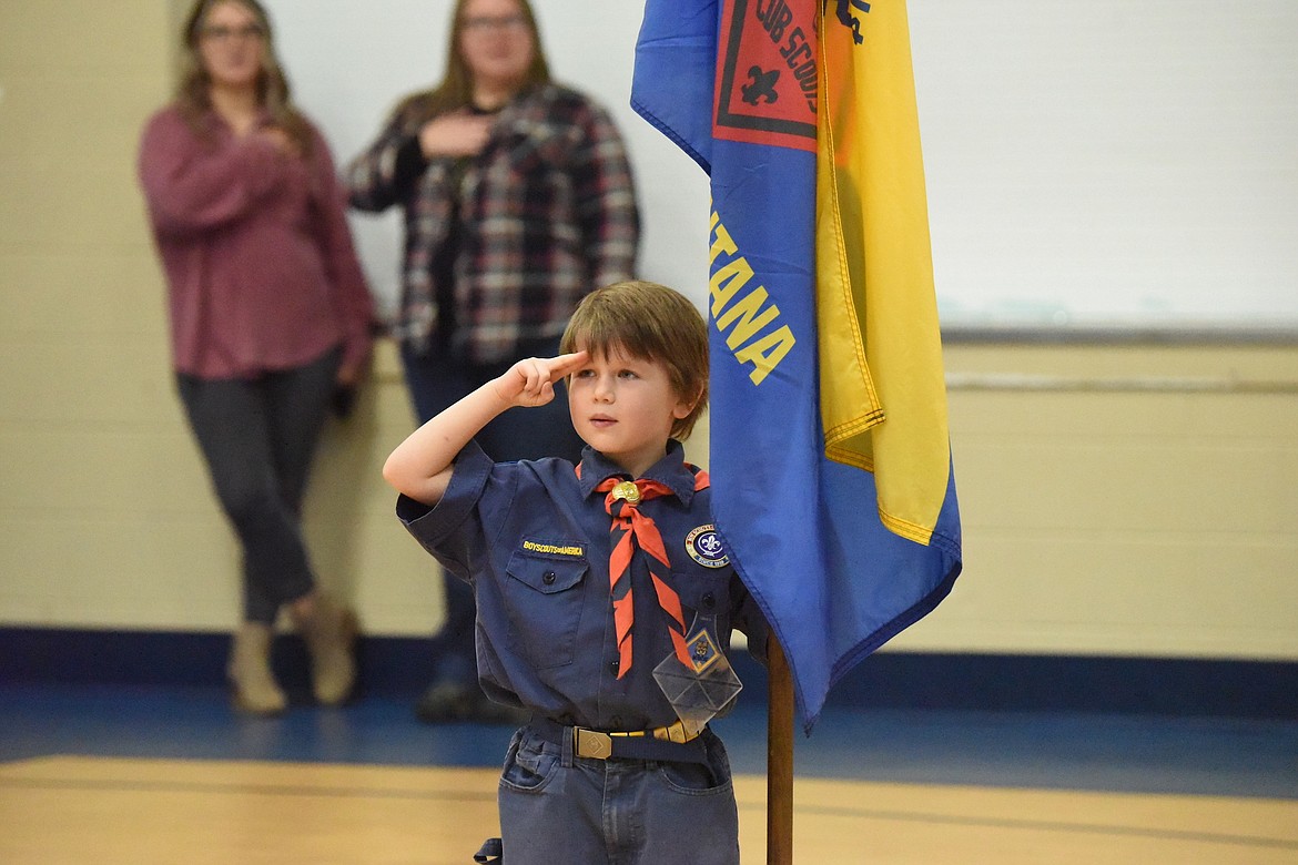 Seven-year-old Cub Scout Liam Lamson presented the State of Montana flag during a Veterans Day ceremony Friday, Nov. 10, at W.F. Morrison Elementary School in Troy. (Scott Shindledecker/The Western News)