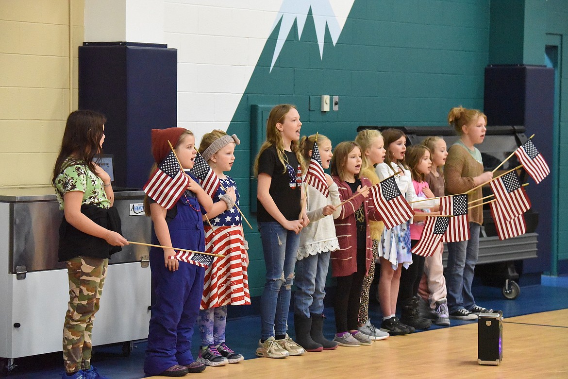 Students at W.F. Morrison Elementary School in Troy sing the national anthem during a Veterans Day ceremony on Friday, Nov. 10. (Scott Shindledecker/The Western News)