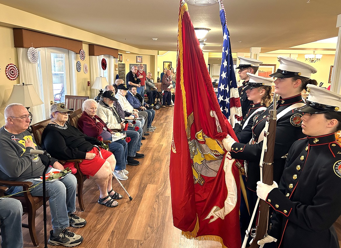 The Kellogg High School Junior Reserve Officers' Training Corps holds flags during a ceremony to honor veterans at Brookdale Coeur d'Alene on Friday. JROTC members, from left, are Ben Milholland, Zoie Lawson, Hannah Walsh and Sopphie McLain.