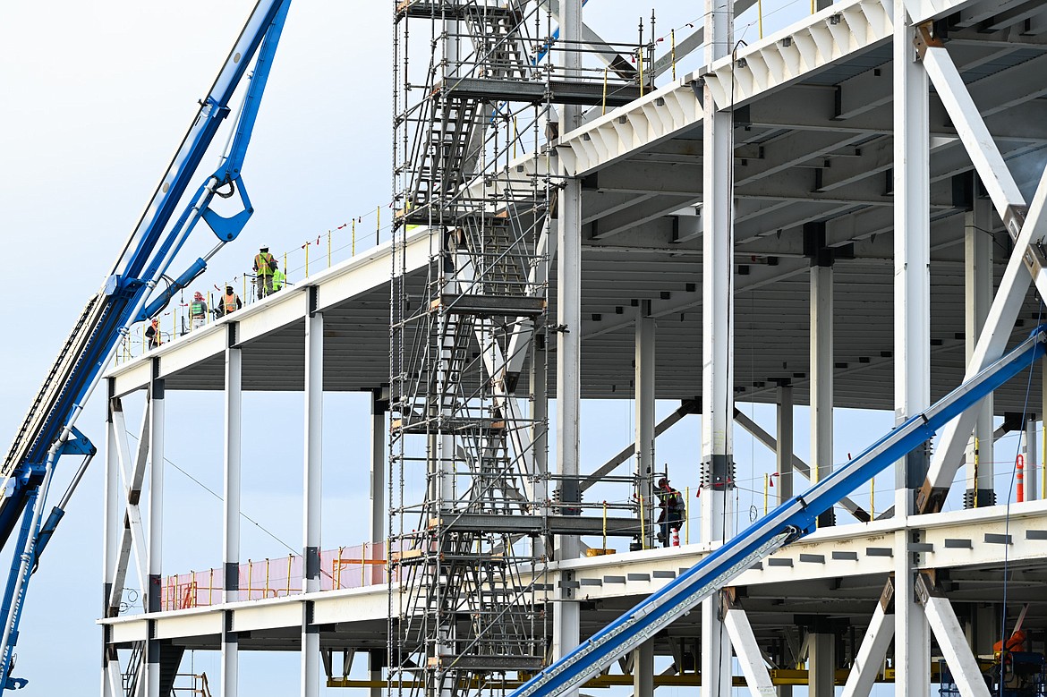 Crews work on walls and floors of the Group14 battery manufacturing facility in Moses Lake