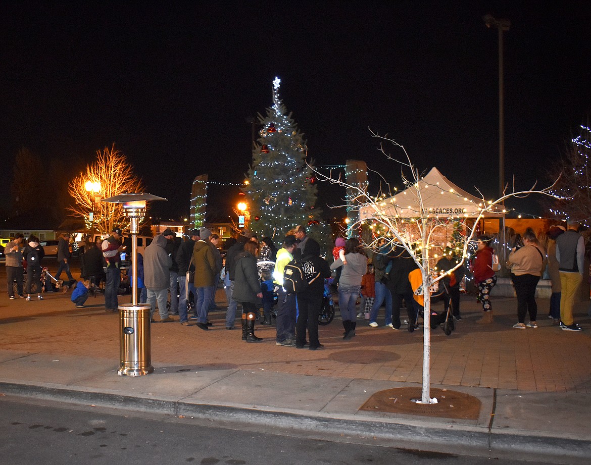 The holiday tree in Sinkiuse Square blazed to life Friday at the annual Downtown Moses Lake Association tree lighting.