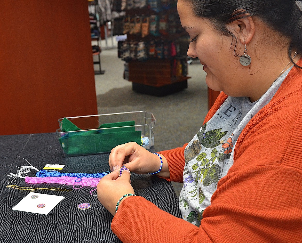 Nadia Adams, education coordinator at Three Chiefs Cultural Center in Pablo, prepares to offer an evening beading class. (Kristi Niemeyer/Leader)