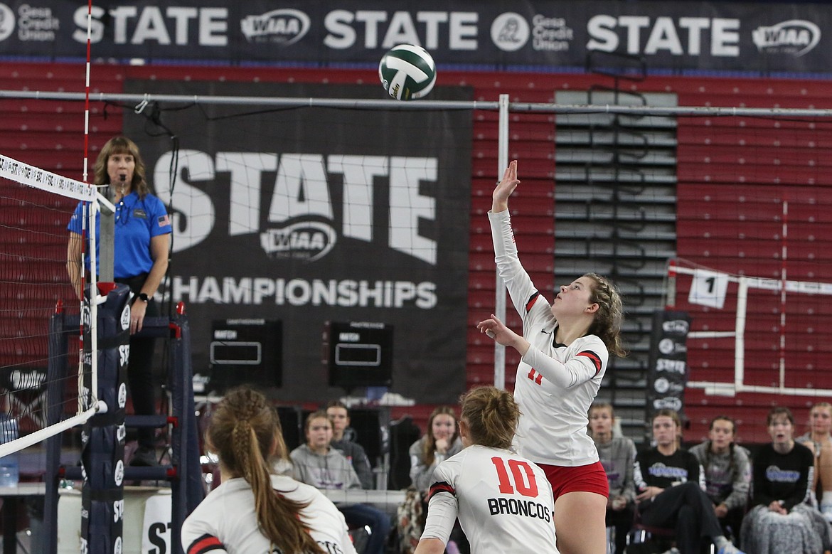 Lind-Ritzville/Sprague senior Megan Melcher (11) tips the ball over the net in the 2B state championship game against Manson.