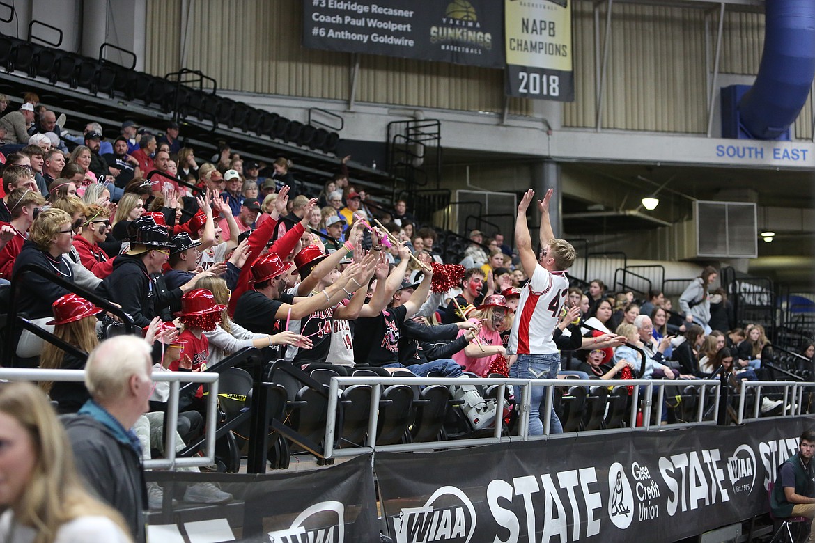 Bronco fans in the stands cheer in between sets at the 2B state championship between Lind-Ritzville/Sprague and Manson.