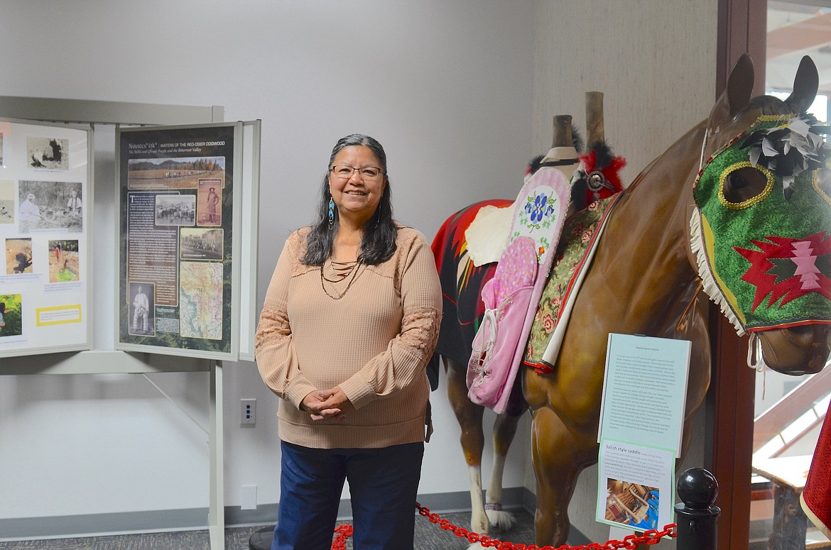 Three Chiefs Cultural Center Director Marie Torosian in the small upstairs exhibit area at the new location in Pablo. More exhibit space will be available as the basement of the former Glacier Bank is remodeled. (Kristi Niemeyer/Leader)