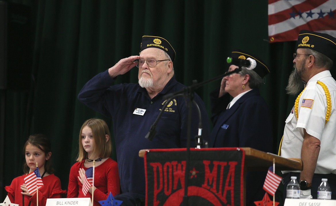 Rathdrum American Legion Post 154 First-Vice Commander Bill Kinder holds a salute Saturday morning during the Veterans Recognition Day event at Lakeland High School.