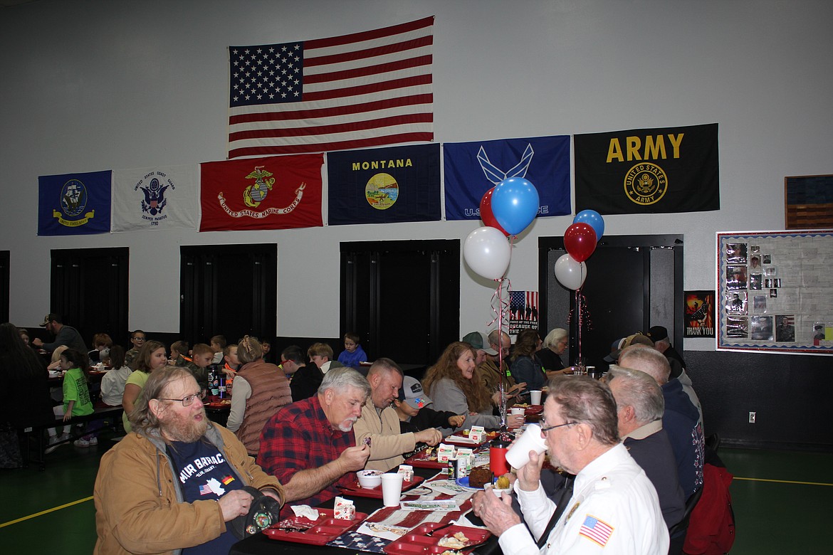 The St. Regis School cafeteria was buzzing with excitement while the students gave thank you cards they made to the veterans who attended their Veterans Breakfast last Thursday. The vets, from all branches of military, enjoyed visiting with them, receiving the cards and the breakfast before the school assembly in the gymnasium. (Monte Turner/Mineral Independent)