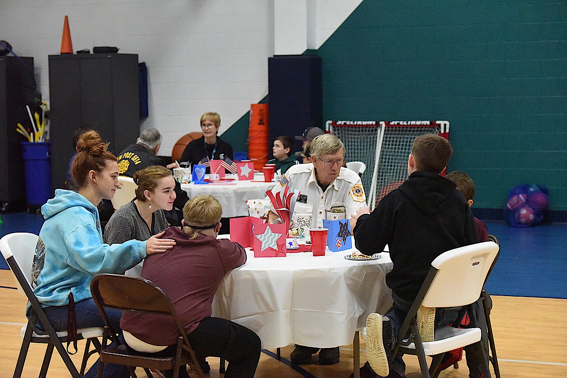 Troy VFW Post 5514 member Jerry Erickson enjoys breakfast with W.F. Morrison Elementary School students on Friday, Nov. 10. (Scott Shindledecker/The Western News)