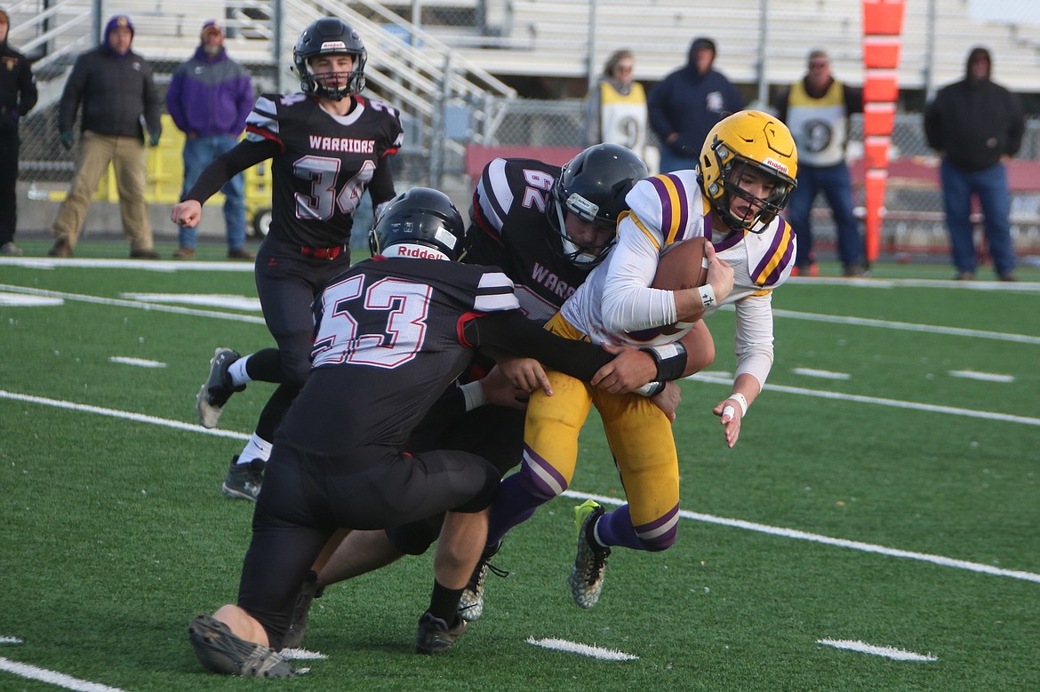 ACH senior John Pierce (53) and junior Kayle Casimir (62) combine for a tackle for loss in the second half against Concrete.