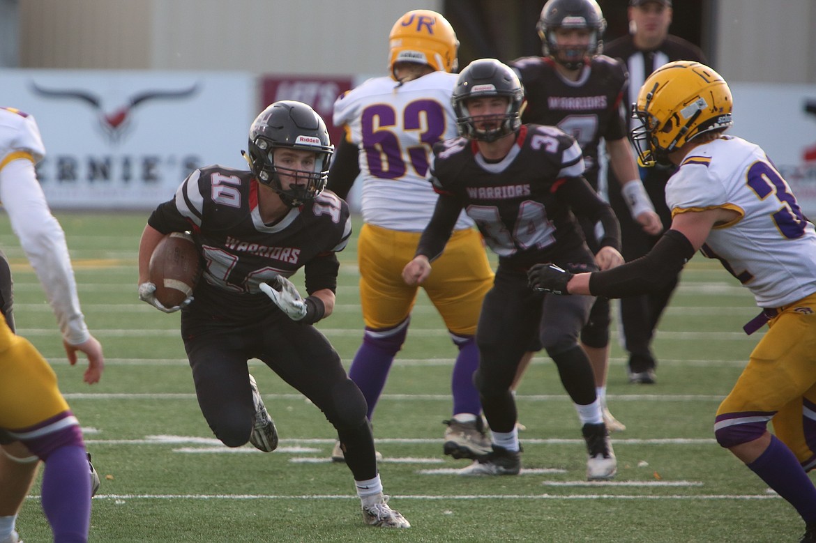 ACH senior Jaxon Baergen (10) carries the football in the fourth quarter against Concrete.