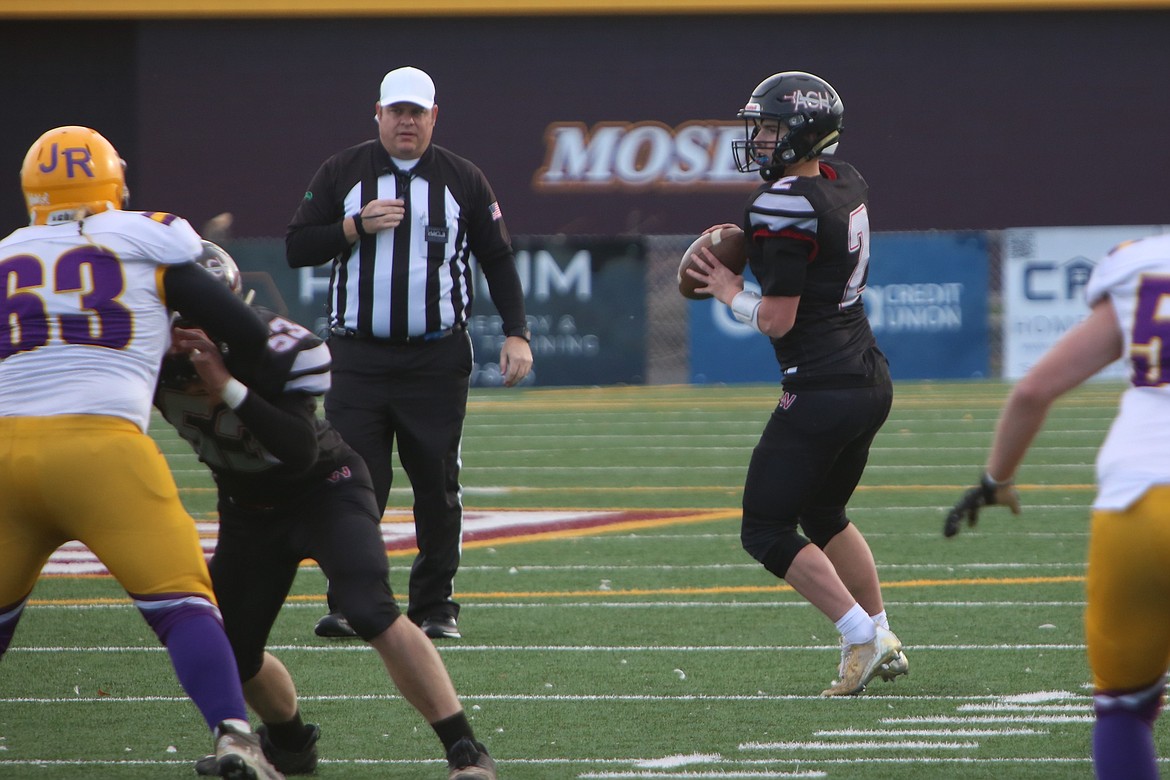 Royal junior Jackson Larsen (21) intercepts a pass in the second quarter against Eatonville Friday.