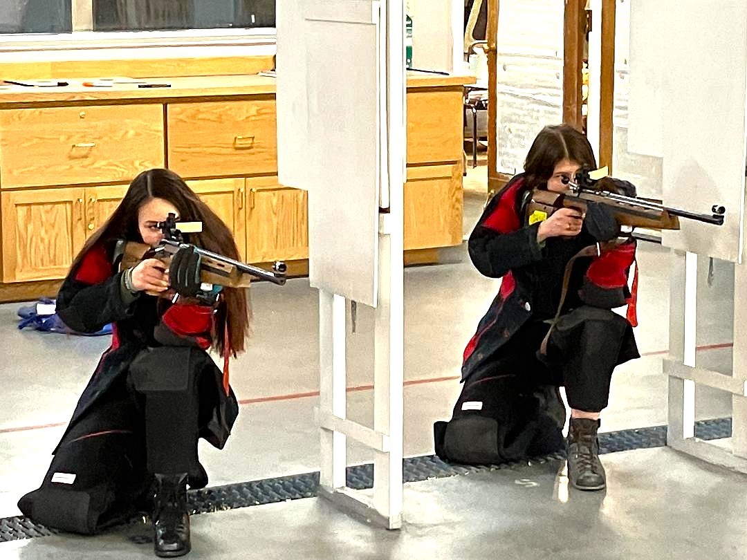 (left) Kyalynn Comer and Salix Harris take aim at the kneeling position.