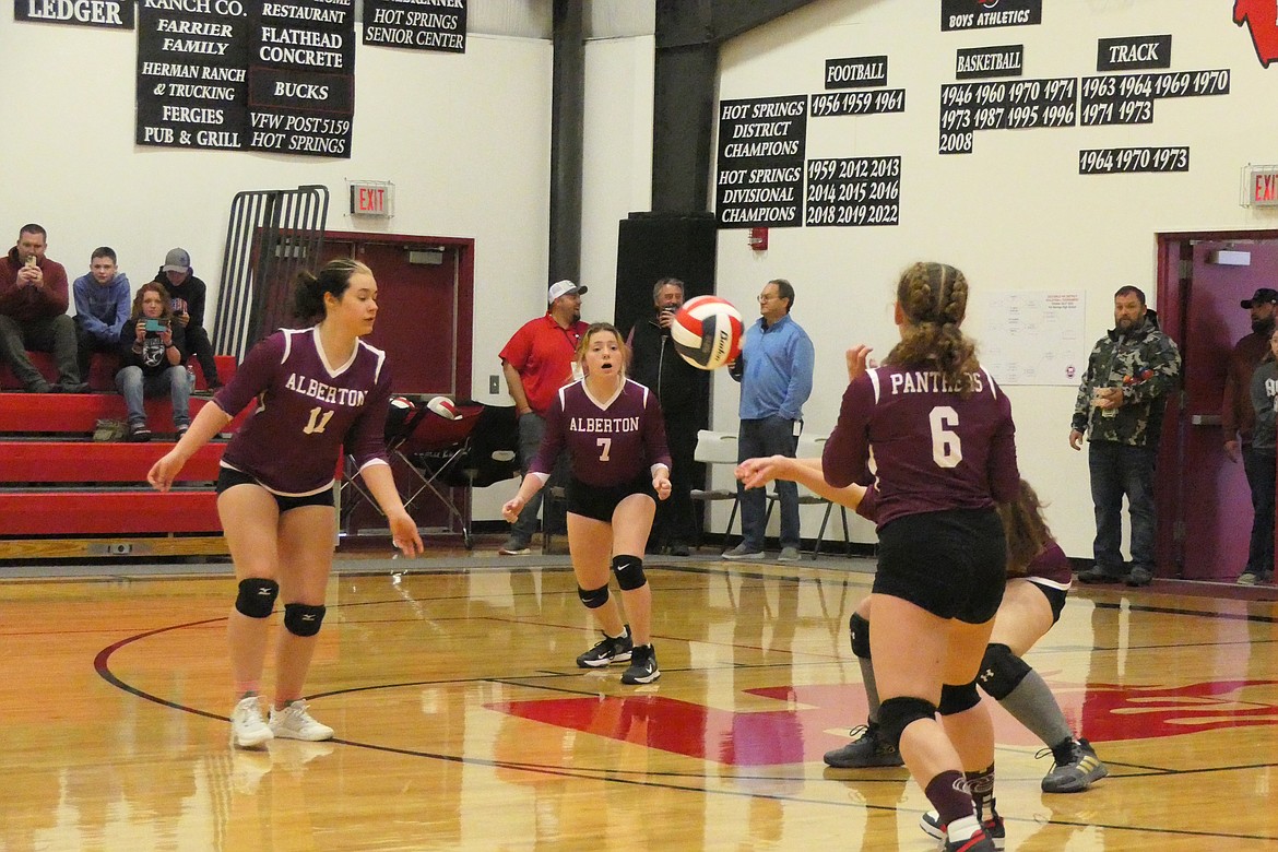 Alberton players circle in incoming shot during district play earlier this season.  (Chuck Bandel/MI-VP)