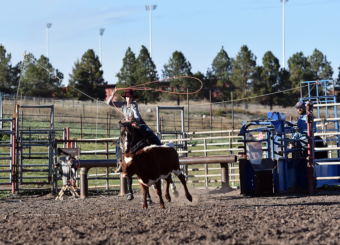 Zoey Bruyer takes a turn as Chance Hays watches at a recent Northwest Montana Rodeo Team practice. (Julie Engler/Whitefish Pilot)