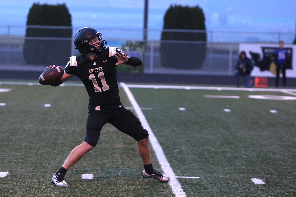 Royal quarterback Lance Allred heaves a pass down the field against Eatonville on Friday night.