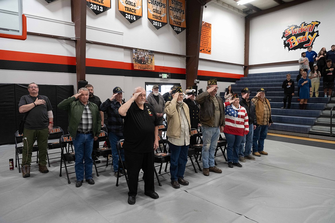 Plains veterans stand for the National Anthem. (Tracy Scott/Valley Press)