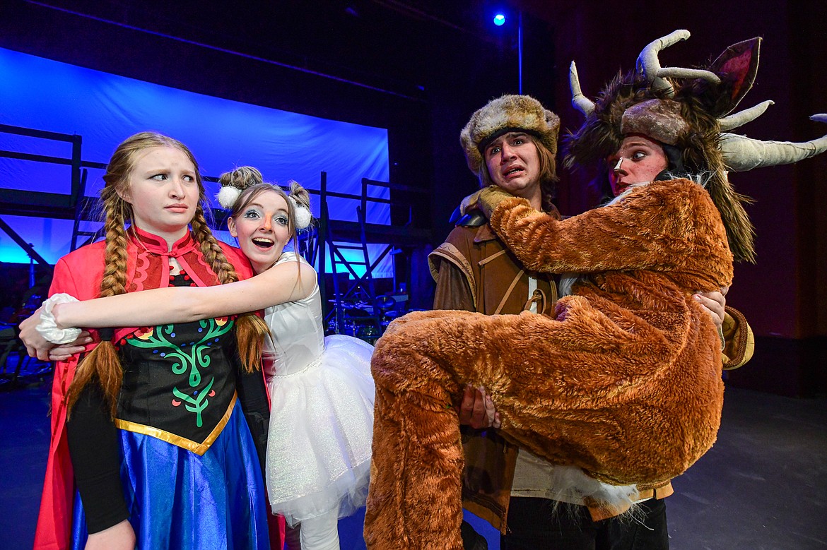 Flathead High School students rehearse a scene from the musical "Frozen" inside the auditorium on Tuesday, Nov. 14. Performing are, from left, Gracyne Johnson as Anna; Adina Lockwood as Olaf; Benjamin Moore as Kristoff; and Bronson Willcut as Sve. (Casey Kreider/Daily Inter Lake)