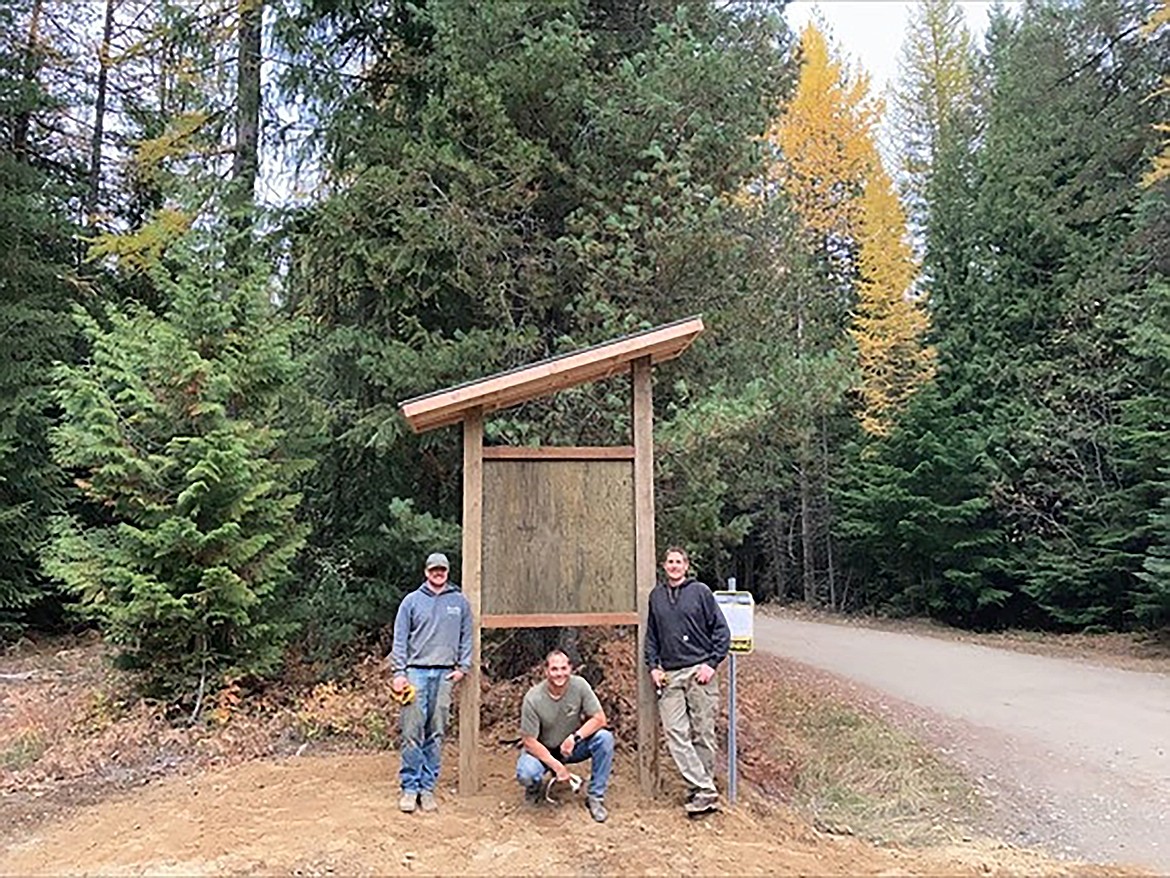 Idaho Department of Lands and Idaho Parks and Recreation recently teamed up to build and install kiosks in the region to post information on winter access on endowment lands. Pictured from left, are Sean Hanley, IDPR trail cat operator; Todd Wernex, IDL recreation program manager; and Nate Sparks, IDPR North Idaho trails specialist with the Ruby Creek Information Kiosk, Boundary County.