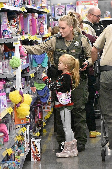 A child and an officer shop for toys at the 2022 Shop With a Cop event in Moses Lake. This year's event starts on December 6 with the Tip-A-Cop event which is then followed by Shop With a Cop on December 19. Multiple first responder agencies, Rock Top Burgers & Brew and the Moses Lake Walmart all work together to bring a bit of joy to children and families in need.