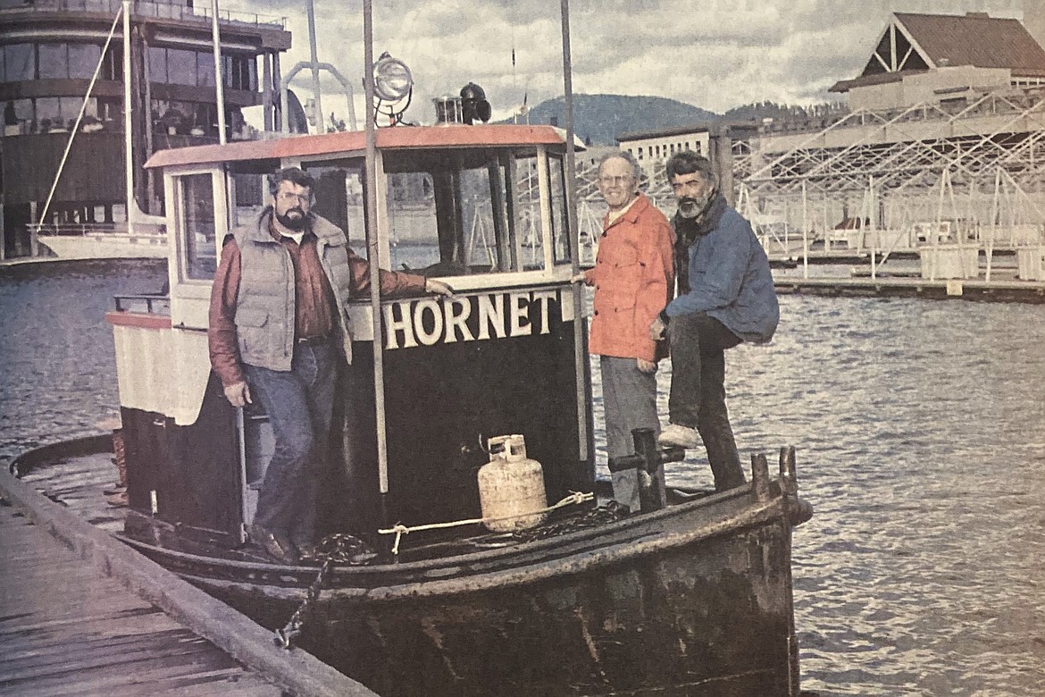 Author Tom Emerson, center, joins Fred Murphy’s sons, Skip, left, and Loren aboard the Hornet.