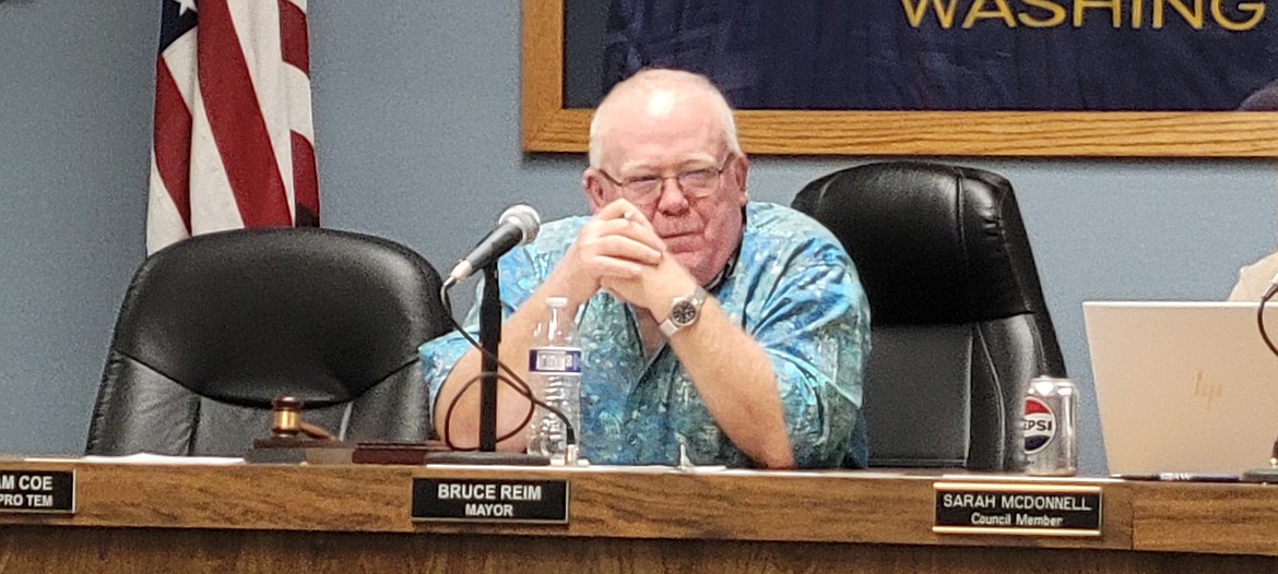 Ephrata Mayor Bruce Reim listens to City Manager Ray Towry discuss budgeting goals for the city during Wednesday night's regular Ephrata City Council meeting. Reim expressed support for the Civil Air Patrol's Wreaths Across America Program both during and after the meeting.