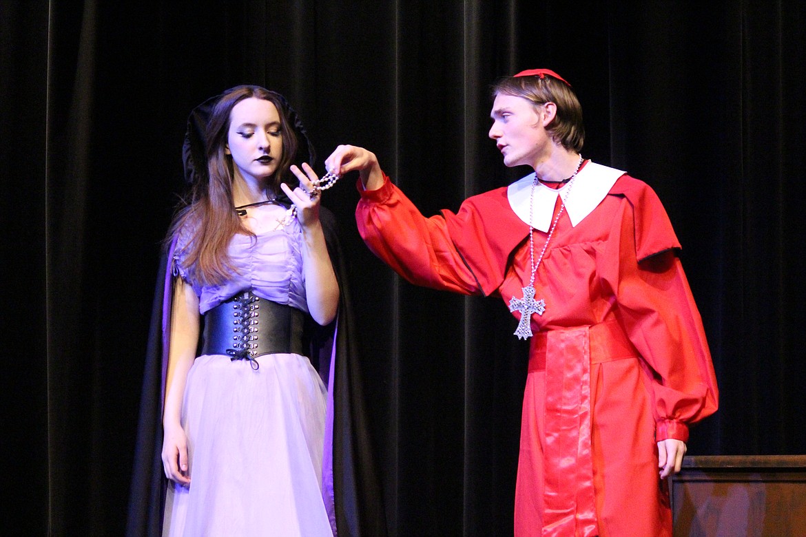 Richelieu (Gaige Anderson, right) provides a means of murder to his wicked niece (Gabriella Whitney, left). The Moses Lake High School production of “The Three Musketeers” opens Friday.