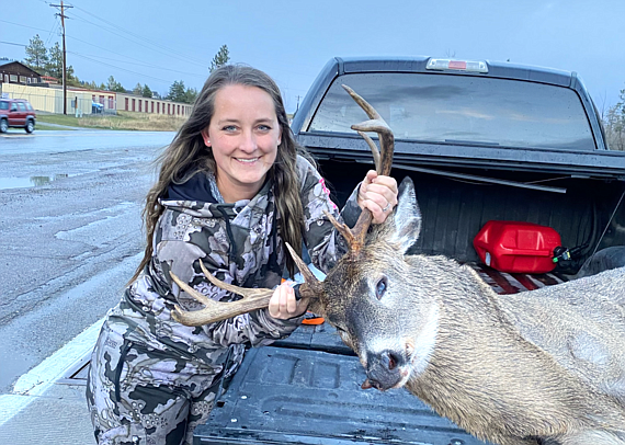 Jennifer Cox with her harvested deer at a game check station in Northwest Montana on Nov. 11, 2023. (FWP photo)