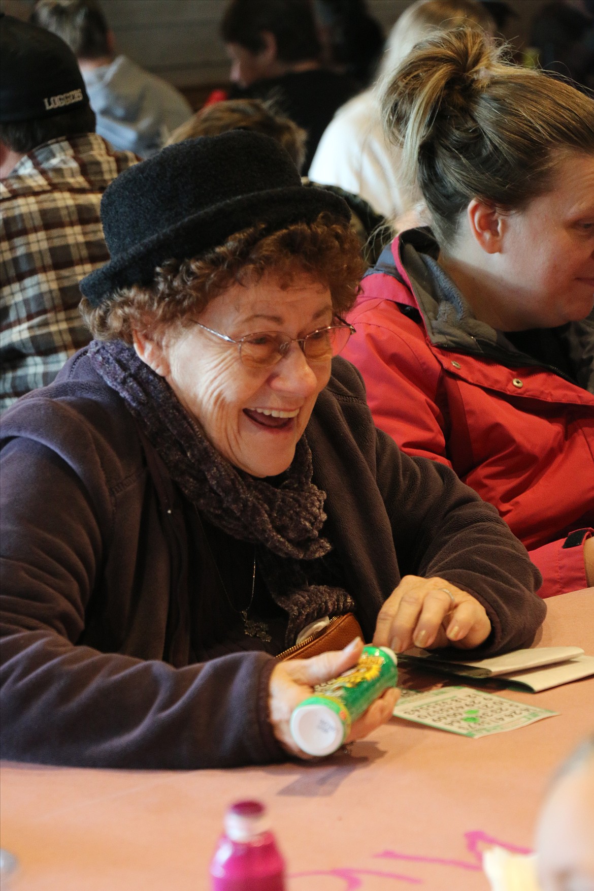 A bingo player at last year's Turkey Bingo laughs while waiting for her numbers to be called. The Sandpoint Lions Club is holding its annual fundraiser Friday and Saturday as it kicks off its annual Toys for Tots Christmas drive.