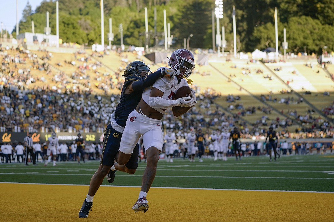 WSU wide receiver Josh Kelly, right, catches a touchdown pass against California last Saturday.
