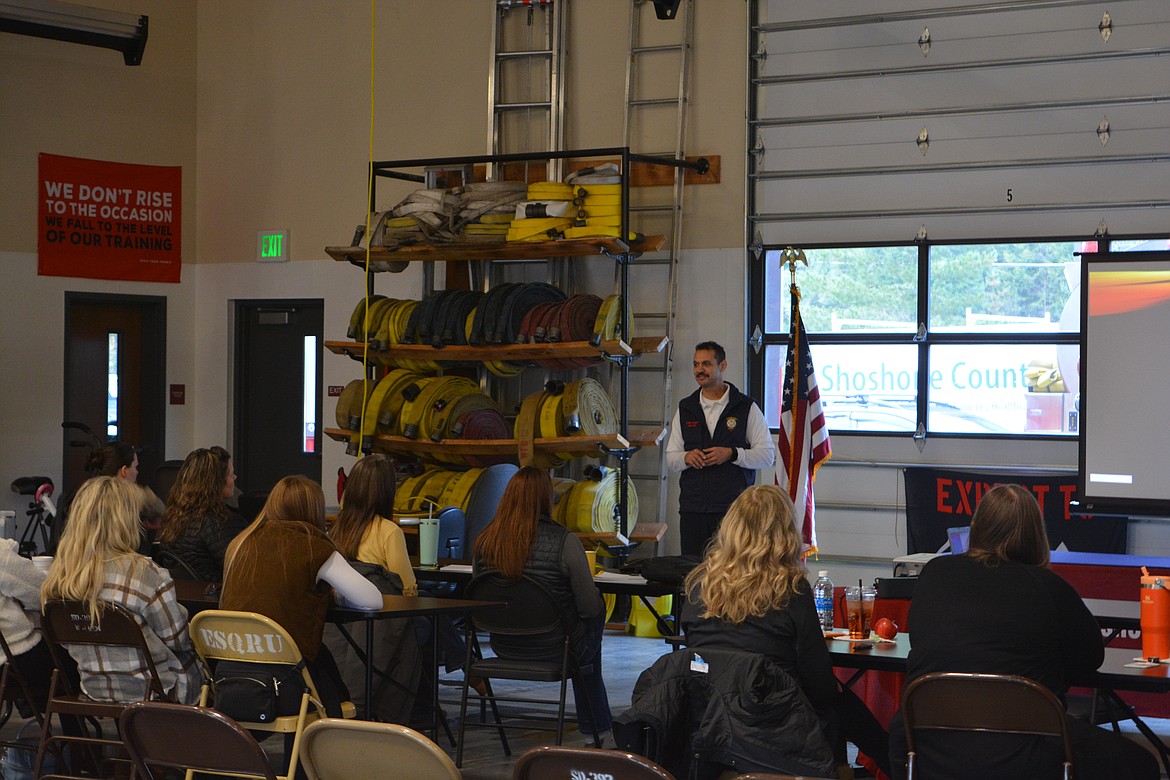 Shoshone Fire District No. 1 Chief John Miller addresses the group learning about trauma and stress coping methods at the station in Osburn.