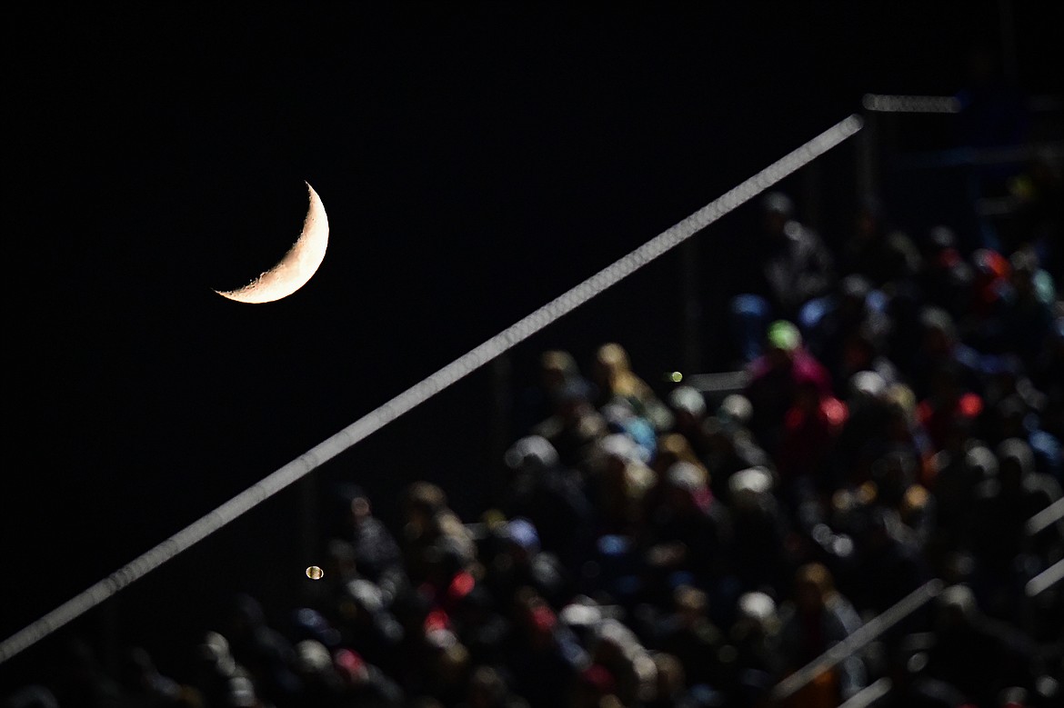 The moon rises behind the bleachers as Glacier and Bozeman square off in the Class AA state championship at Van Winkle Stadium on Friday, Nov. 17. (Casey Kreider/Daily Inter Lake)