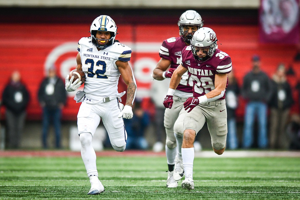 Bobcats running back Julius Davis (32) breaks a 30-yard run in the second quarter against the Grizzlies in the 122nd Brawl of the Wild at Washington-Grizzly Stadium on Saturday, Nov. 18. (Casey Kreider/Daily Inter Lake)