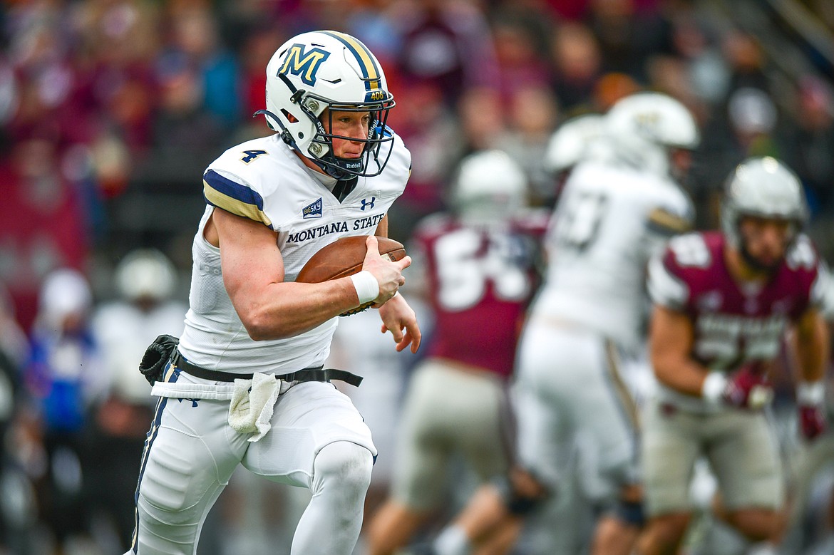 Bobcats quarterback Tommy Mellott (4) looks for running room in the first quarter against Montana in the 122nd Brawl of the Wild at Washington-Grizzly Stadium on Saturday, Nov. 18. (Casey Kreider/Daily Inter Lake)