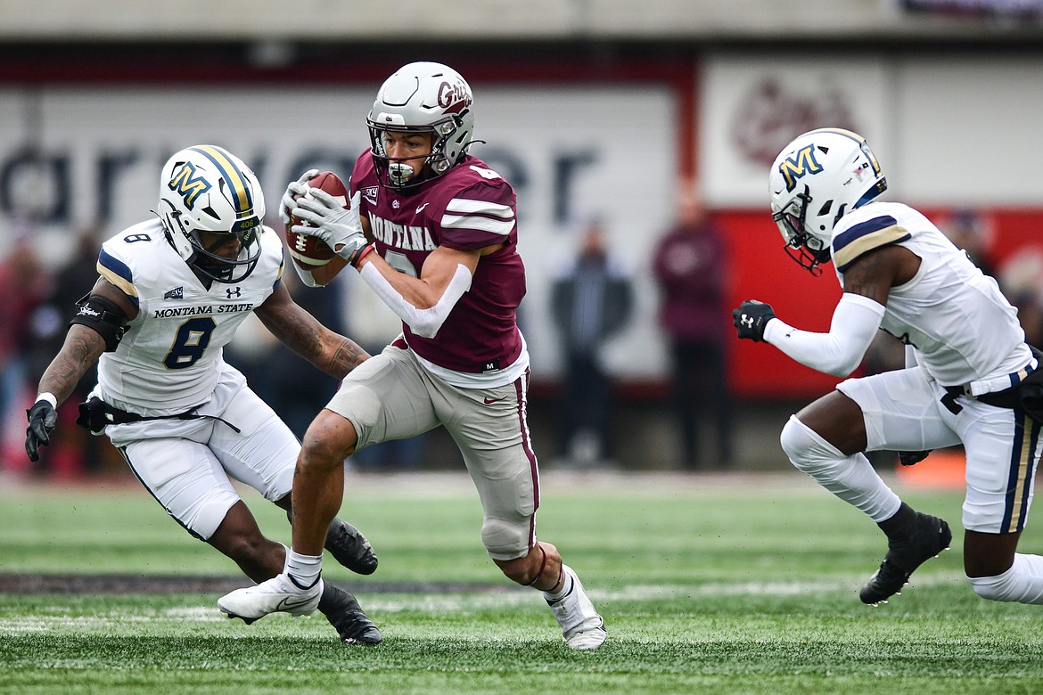 Grizzlies wide receiver Keelan White (6) picks up yardage after a reception in the first quarter against Montana State in the 122nd Brawl of the Wild at Washington-Grizzly Stadium on Saturday, Nov. 18. (Casey Kreider/Daily Inter Lake)