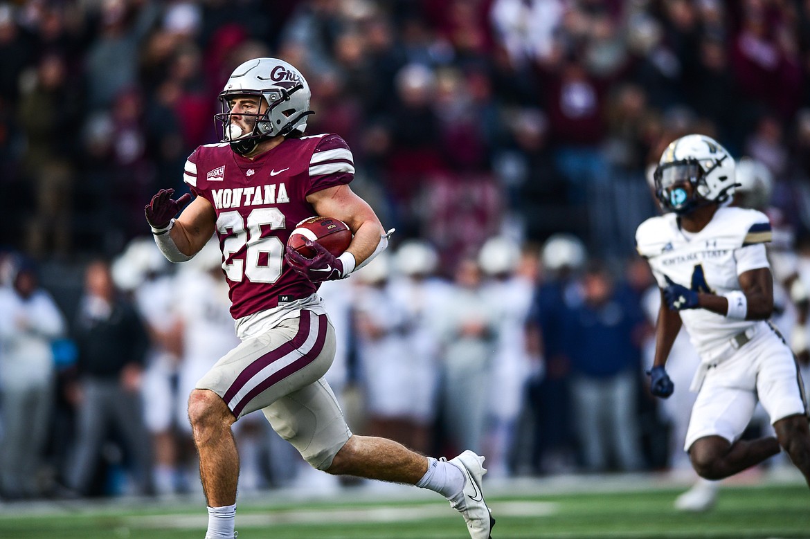 Grizzlies running back Nick Ostmo (26) heads to the end zone on a 64-yard touchdown run in the fourth quarter against Montana State in the 122nd Brawl of the Wild at Washington-Grizzly Stadium on Saturday, Nov. 18. (Casey Kreider/Daily Inter Lake)