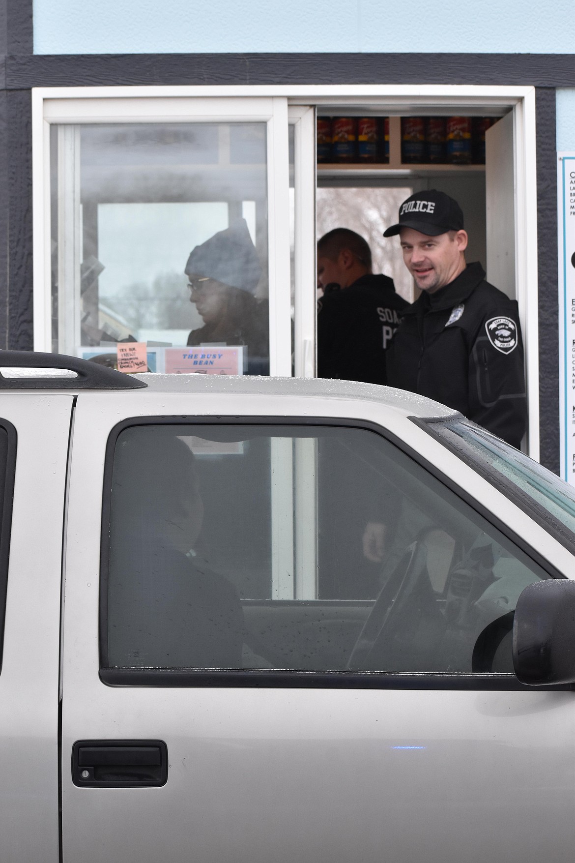 Soap Lake Police Department officers serve coffee during Tip A Cop 2022. The 2023 fundraiser is Dec. 5.