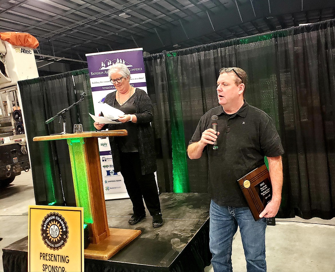 Rathdrum Chamber of Commerce board Vice President Suzanna Spencer presents the Nonprofit of the Year award to Fire Chief Pat Riley for the Northern Lakes Fire District.