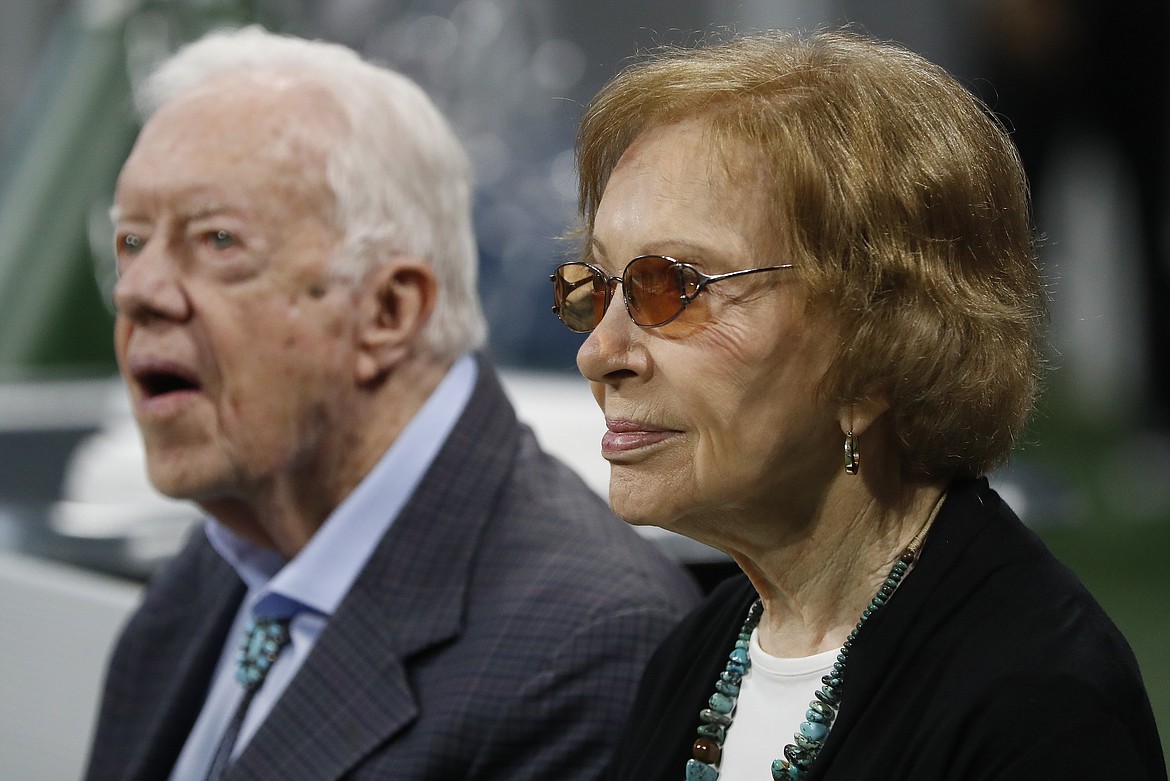 Former President Jimmy Carter, left, and his wife, former first lady Rosalynn Carter, are seen ahead of an NFL football game between the Atlanta Falcons and the Cincinnati Bengals, Sept. 30, 2018, in Atlanta. Rosalynn Carter, the closest adviser to Jimmy Carter during his one term as U.S. president and their four decades thereafter as global humanitarians, died Sunday, Nov. 19, 2023. She was 96. (AP Photo/John Bazemore, File)