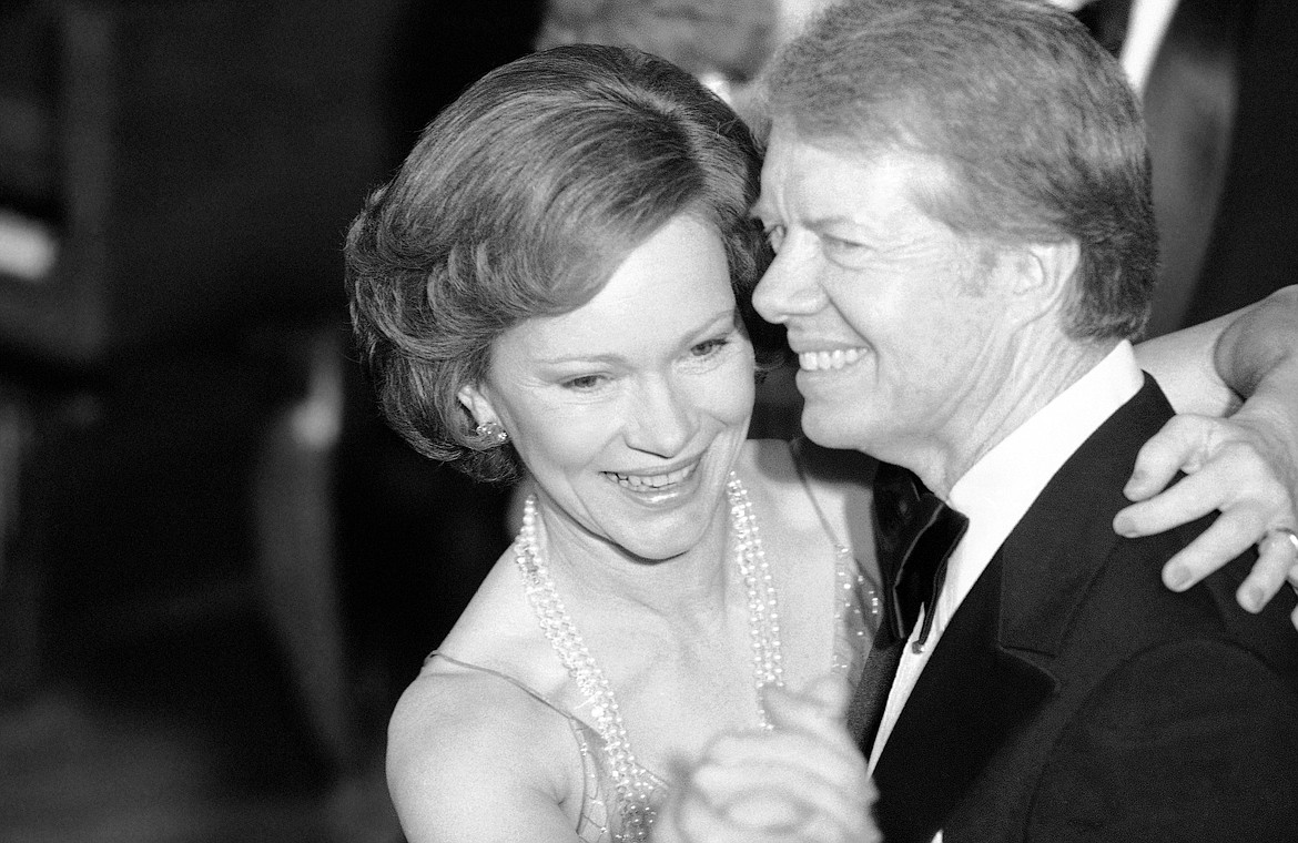 President Jimmy Carter, right, and his wife, first lady Rosalynn Carter, lead their guests in dancing at the annual Congressional Christmas Ball, Dec. 13, 1978, at the White House in Washington. Rosalynn Carter, the closest adviser to Jimmy Carter during his one term as U.S. president and their four decades thereafter as global humanitarians, died Sunday, Nov. 19, 2023. She was 96. (AP Photo/Ira Schwarz, File)