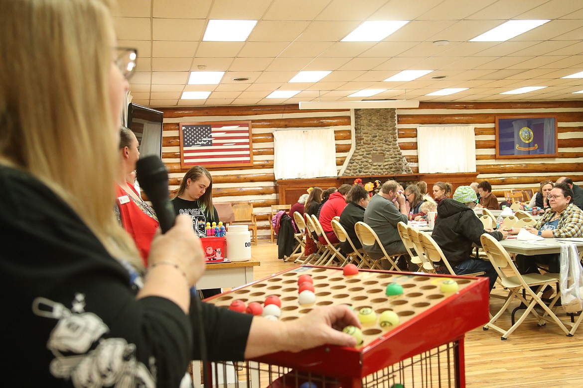 Sandpoint Lions president Janice Rader calls a bingo number at the club's Turkey Bingo fundraiser on Saturday. The annual event is the traditional beginning of the Lions' annual Christmas drive, Toys for Tots.