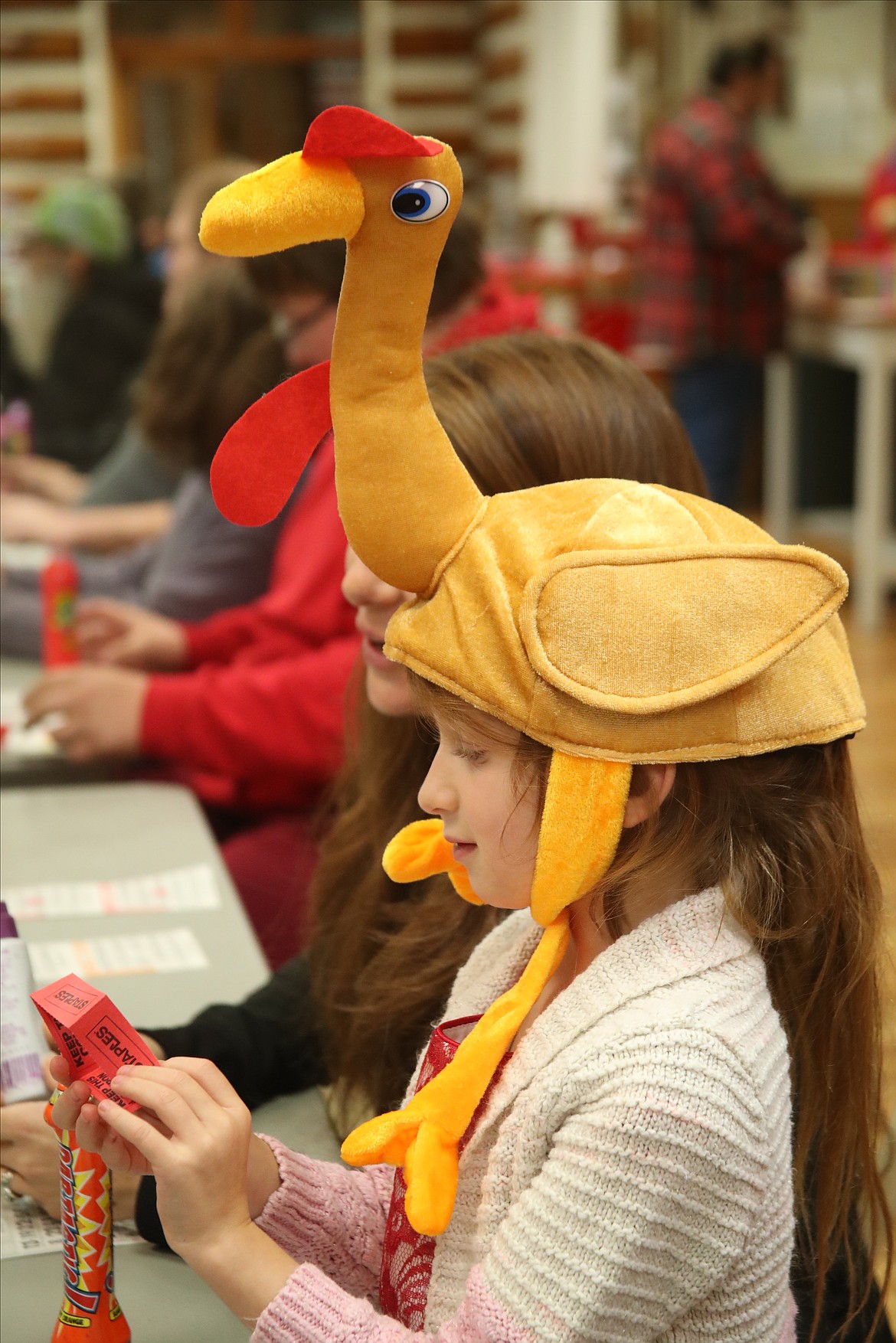Brooke Schramm shows a little Thanksgiving style at Saturday's Turkey Bingo fundraiser. The annual event is the traditional beginning of the Lions' annual Christmas drive, Toys for Tots.