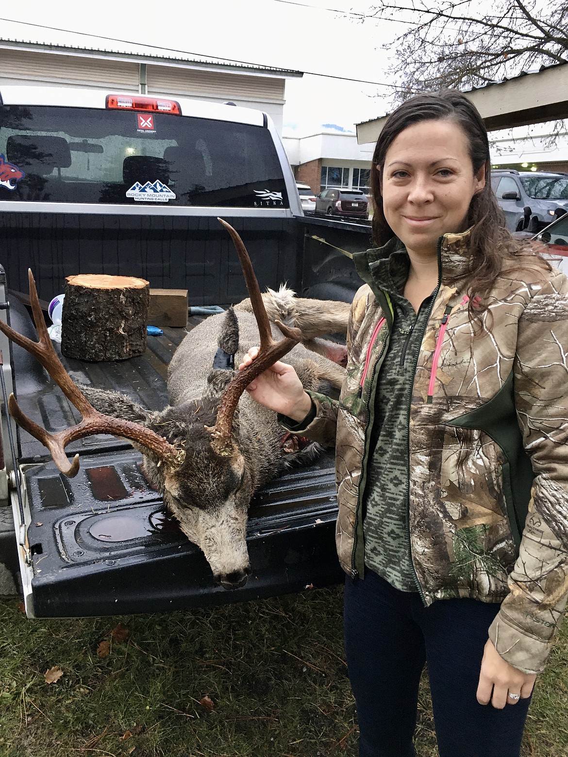 I wasn't able to get a picture of my buck in the field, because of our quick retreat with the boys. So first thing in the morning after my husband and our friend got it home, I went out and posed with my harvest. (Mineral Independent/Amy Quinlivan)