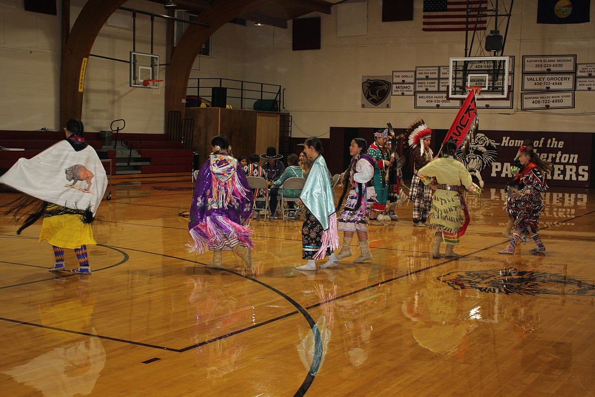 The Nkwusm Salish Language School from Arlee performs traditional dance and drumming in authentic Salish attire at Alberton School. (Photo provided)