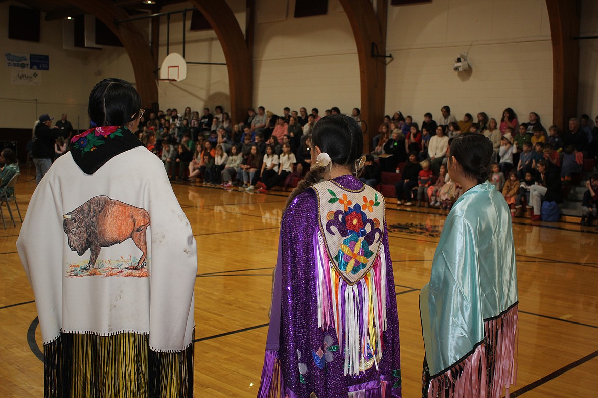 The Nkwusm Salish Language School from Arlee performs traditional dance and drumming in authentic Salish attire at Alberton School. (Photo provided)